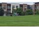 Modern playground equipment surrounded by lush greenery, nestled within a residential community, creating an engaging play space at 400 E Fremont Pl # 207, Littleton, CO 80122