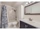 Updated bathroom with modern vanity, fixtures, and a shower-tub combination at 750 S Clinton St # 2C, Denver, CO 80247