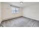 Well-lit bedroom with carpet flooring and window with blinds at 750 S Clinton St # 2C, Denver, CO 80247