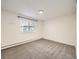 Neutral bedroom with carpet, closet, and natural light from the window at 750 S Clinton St # 2C, Denver, CO 80247