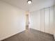 Bright bedroom with neutral carpet, white walls and double closets at 750 S Clinton St # 2C, Denver, CO 80247