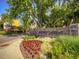 Entrance sign for Windsor Gardens with landscaping at 750 S Clinton St # 2C, Denver, CO 80247