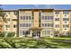 Apartment building exterior featuring well-maintained landscaping and architectural details at 750 S Clinton St # 2C, Denver, CO 80247