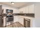 Modern kitchen with stainless steel appliances and updated countertops at 750 S Clinton St # 2C, Denver, CO 80247