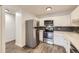 Well-equipped kitchen featuring stainless steel appliances and updated finishes at 750 S Clinton St # 2C, Denver, CO 80247