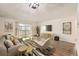 Bright living room with wood floors, large window, and contemporary furnishings at 750 S Clinton St # 2C, Denver, CO 80247