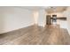 Open concept living space with hardwood floors and adjacent kitchen at 750 S Clinton St # 2C, Denver, CO 80247