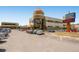 View of building parking lot with cars parked at 750 S Clinton St # 2C, Denver, CO 80247