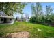 Spacious backyard featuring a well-maintained lawn and shed at 8020 W 46Th Cir, Wheat Ridge, CO 80033