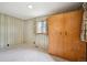 Bedroom with neutral-toned wallpaper and carpet at 8020 W 46Th Cir, Wheat Ridge, CO 80033