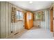 Bedroom with neutral-toned wallpaper and carpet at 8020 W 46Th Cir, Wheat Ridge, CO 80033