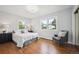 Bright bedroom with hardwood floors, lots of natural light, and neutral decor at 8020 W 46Th Cir, Wheat Ridge, CO 80033