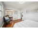 Spacious bedroom featuring hardwood floors, ample natural light, and a comfortable seating area at 8020 W 46Th Cir, Wheat Ridge, CO 80033