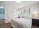Bright bedroom with hardwood floors, closet and modern decor at 8020 W 46Th Cir, Wheat Ridge, CO 80033