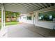 Covered patio area with a concrete surface, providing an outdoor living space with access to backyard and home at 8020 W 46Th Cir, Wheat Ridge, CO 80033