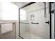 Walk-in shower featuring contemporary tile and fixtures, and glass enclosure in the bathroom at 8020 W 46Th Cir, Wheat Ridge, CO 80033