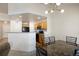 Inviting space with hardwood floors near kitchen area and eat-in dining with modern lighting at 23625 E Kettle Pl, Aurora, CO 80016