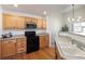 Well-equipped kitchen featuring stainless steel appliances, wood cabinetry, and hardwood flooring at 23625 E Kettle Pl, Aurora, CO 80016