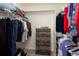 Organized walk-in closet featuring ample hanging space and a chest of drawers for optimal storage at 23625 E Kettle Pl, Aurora, CO 80016