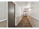 Long hallway with carpet and neutral paint at 625 N Pennsylvania St # 208, Denver, CO 80203