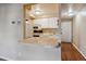 Open concept apartment living room open to kitchen, with hardwood floors at 625 N Pennsylvania St # 208, Denver, CO 80203