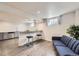 Basement featuring a counter with bar stool seating, hard surface floors and natural light at 427 Hickory St, Broomfield, CO 80020