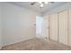 Bedroom with neutral colored carpet, white walls, and closet storage at 427 Hickory St, Broomfield, CO 80020