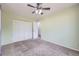 A cozy bedroom features neutral walls, a large closet and plush carpet at 427 Hickory St, Broomfield, CO 80020