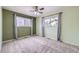 Inviting bedroom enhanced with soft drapes, neutral toned carpet, and a ceiling fan at 427 Hickory St, Broomfield, CO 80020