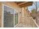 View of a private balcony with white railing and a sliding glass door to the condo at 7395 E Quincy Ave # 207, Denver, CO 80237
