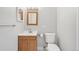 Bathroom with neutral paint, tile floor, and wood vanity at 7395 E Quincy Ave # 207, Denver, CO 80237