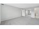 Image shows a room with new carpet, neutral paint and view to bath at 7395 E Quincy Ave # 207, Denver, CO 80237