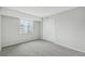 Bedroom with light gray walls, carpeted floor, and closet at 7395 E Quincy Ave # 207, Denver, CO 80237