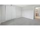 Bedroom with closet, new carpet and neutral paint at 7395 E Quincy Ave # 207, Denver, CO 80237
