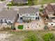 Aerial view of backyard with lovely landscaping, fenced yard, patio, and stone pathway at 3929 Spanish Oaks Trl, Castle Rock, CO 80108
