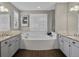 This bathroom boasts a large soaking tub, tile surround, and granite vanity at 3929 Spanish Oaks Trl, Castle Rock, CO 80108
