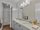 This bathroom features a dual sink vanity and separate shower and toilet room at 3929 Spanish Oaks Trl, Castle Rock, CO 80108