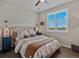 This bedroom is bright with a large window overlooking a beautiful landscape at 3929 Spanish Oaks Trl, Castle Rock, CO 80108