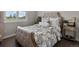 Cozy bedroom is bright with a shuttered window overlooking a beautiful landscape at 3929 Spanish Oaks Trl, Castle Rock, CO 80108