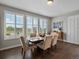 Dining room with plantation shutters, hardwood floors and modern decor at 3929 Spanish Oaks Trl, Castle Rock, CO 80108