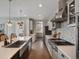 Modern kitchen with a stainless steel farmhouse sink, professional-grade appliances, and open layout at 3929 Spanish Oaks Trl, Castle Rock, CO 80108