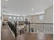 A second-story loft boasts hardwood floors and wrought iron railing at 3929 Spanish Oaks Trl, Castle Rock, CO 80108