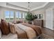 A luxurious main bedroom is bright with natural light and trey ceilings at 3929 Spanish Oaks Trl, Castle Rock, CO 80108