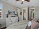 Comfortable main bedroom with a ceiling fan, and view of the ensuite bathroom at 3929 Spanish Oaks Trl, Castle Rock, CO 80108