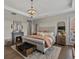 Relaxing main bedroom features hardwood floors, a ceiling fan, and a cozy fireplace at 3929 Spanish Oaks Trl, Castle Rock, CO 80108
