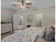 Comfortable main bedroom with a ceiling fan, adjacent closet and a view to the bonus room at 3929 Spanish Oaks Trl, Castle Rock, CO 80108