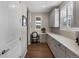 Functional office space with built-in cabinets, desk, and ample natural light from the shuttered windows at 3929 Spanish Oaks Trl, Castle Rock, CO 80108