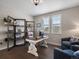 Cozy office with large windows, a stylish desk, shelving, and comfortable seating area with hardwood flooring at 3929 Spanish Oaks Trl, Castle Rock, CO 80108