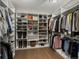 Organized walk-in closet featuring custom shelving and ample storage space for clothing and accessories at 3929 Spanish Oaks Trl, Castle Rock, CO 80108