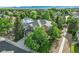 Overhead shot of a well-maintained home with a lush, green yard and mature trees at 505 Orchard Dr, Louisville, CO 80027